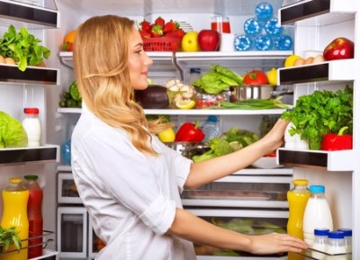 25864226 - happy female search something in the fridge, fresh fruits and vegetables in the refrigerator, cooking diet food, fit and body care concept